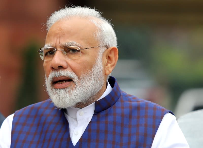 FILE PHOTO: India's PM Modi speaks to the media inside the parliament premises on the first day of the winter session in New Delhi