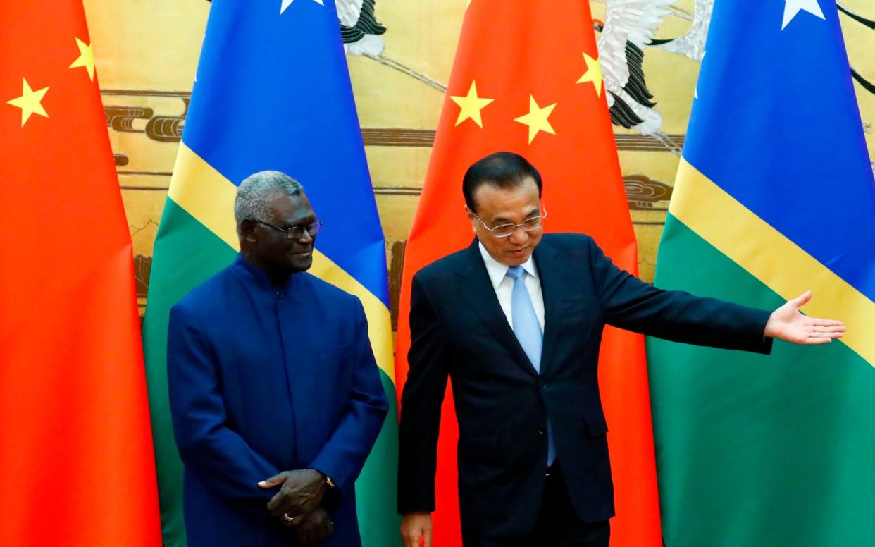 Solomon Islands Prime Minister Manasseh Sogavare with Chinese Premier Li Keqiang - AFP