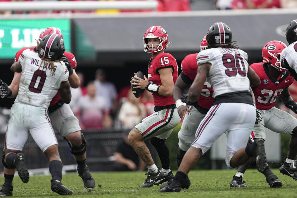Georgia quarterback Carson Beck (15) looks for an open receiver during the first half of an NCAA college football game against South Carolina Saturday, Sept. 16, 2023, Ga. (AP Photo/John Bazemore)