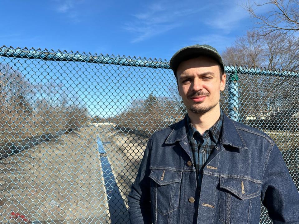 Windsor wildlife photography enthusiast Joshua Haddad stands near the Grand Marais Drain in the city's south end in March 2024.