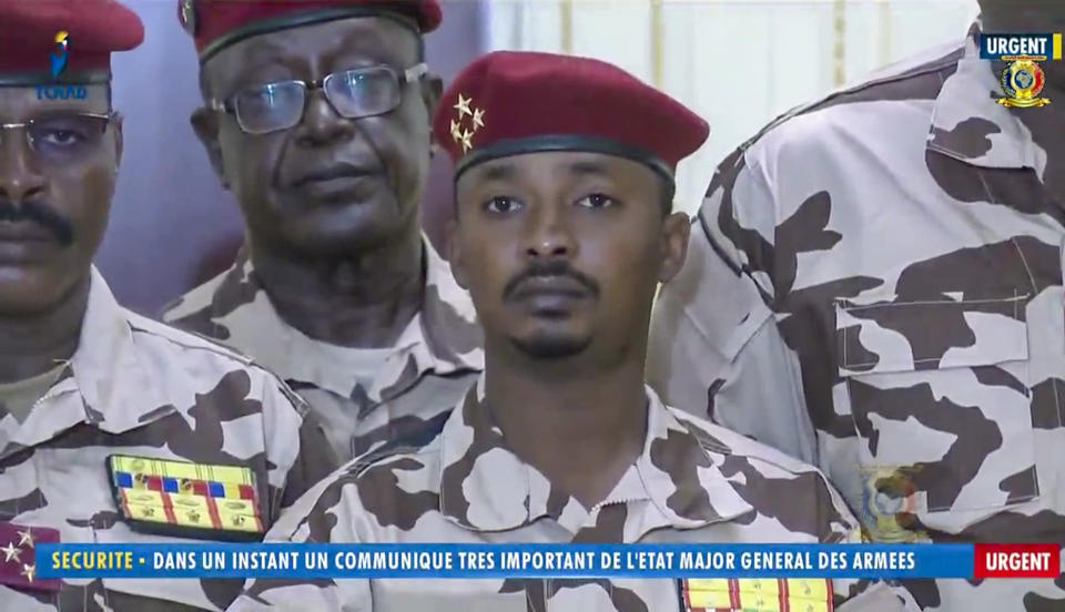 Mahamat Idriss Deby Itno, 37, the son of Chadian President Idriss Deby Itno, is seen during a military broadcast announcing the death of his father on state television Tuesday, April 20, 2021. Deby, who ruled the central African nation for more than three decades, was killed on the battlefield Tuesday, April 20, 2021 in a fight against rebels, the military announced on national television and radio. Onscreen writing in French reads "Security - In a moment a very important communique from the General Staff of the Military - Urgent". (Tele Tchad via AP)