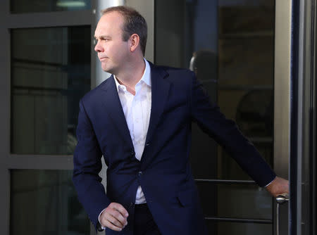 Rick Gates, a former campaign official for U.S. President Donald Trump, departs U.S. District Court after he and Trump's former campaign manager Paul Manafort attended a hearing in the first charges stemming from a special counsel investigation of possible Russian meddling in the 2016 presidential election in Washington, U.S., October 30, 2017. REUTERS/Jim Urquhart