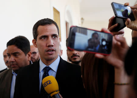 Venezuelan opposition leader and self-proclaimed interim president Juan Guaido speaks to the media before a session of the Venezuela’s National Assembly in Caracas, Venezuela January 29, 2019. REUTERS/Carlos Garcia Rawlins