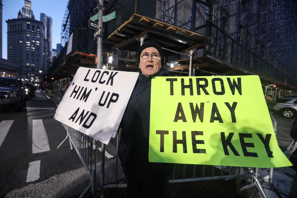 Robert Hoatson of West Orange, N.J. holds signs outside the Manhattan Criminal Courthouse March 30, 2023, after a grand jury indicted former President Donald Trump in connection with allegations of paying hush money to a former porn actress. 