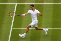 <p>Grigor Dimitrov of Bulgaria plays a forehand during the Men’s Singles second round match against Gilles Simon of France on day four of the Wimbledon Lawn Tennis Championships at the All England Lawn Tennis and Croquet Club on June 30, 2016 in London, England. (Photo by Julian Finney/Getty Images)</p>