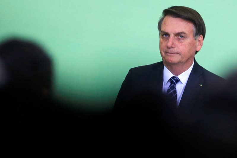 Brazil's President Jair Bolsonaro looks on during a ceremony at the Planalto Palace in Brasilia