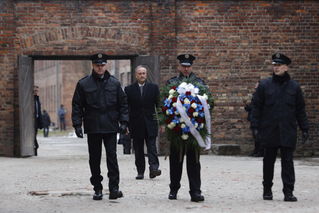 Second Gentleman Douglas Emhoff, second left, visits the former Nazi German concentration and extermination camp KL Auschwitz during ceremonies marking the 78th anniversary of the liberation of the camp in Oswiecim, Poland, Friday, Jan. 27, 2023. (AP Photo/Michal Dyjuk)