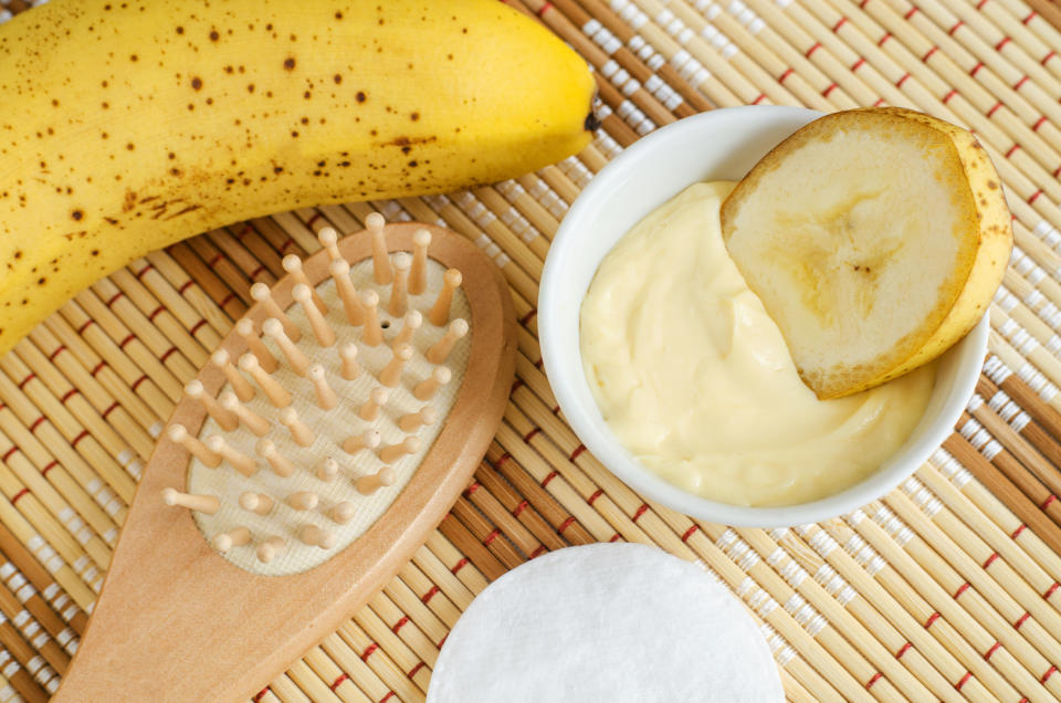 Banana and hairbrush on top of table