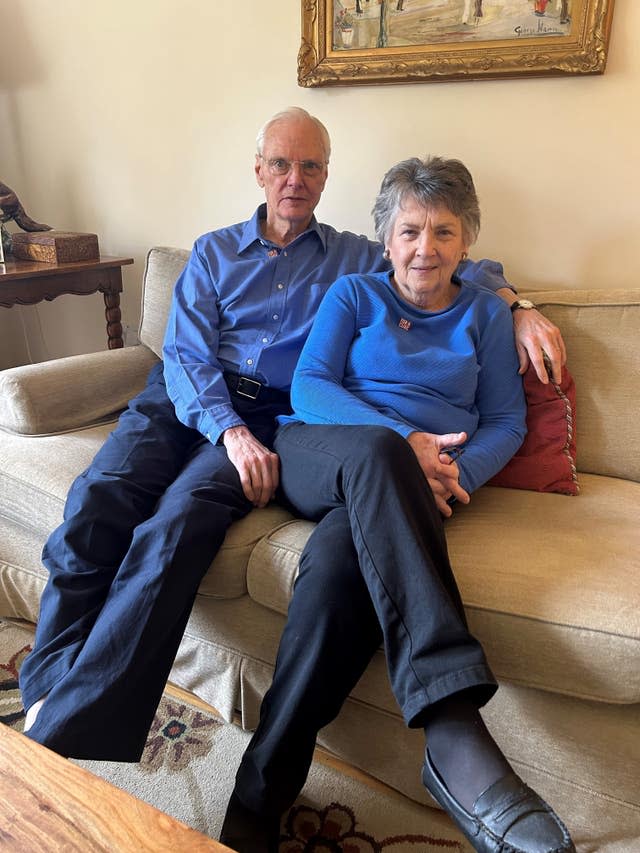 Larry Woelk, 77, and his wife Rita sat on a sofa