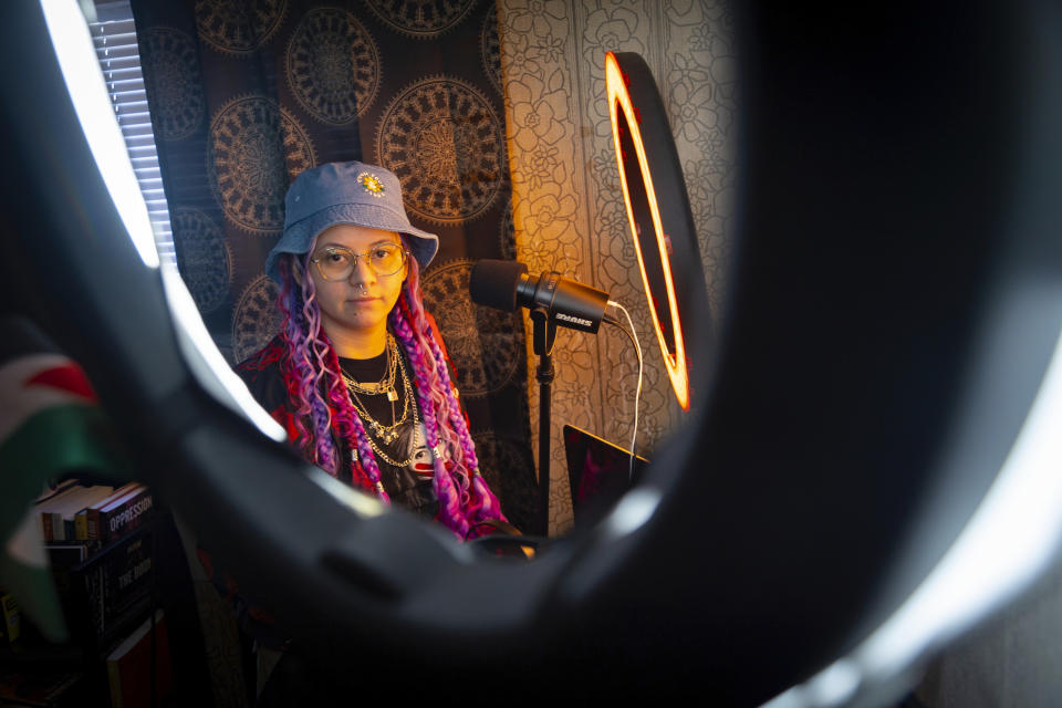 Kimra Luna sits for a portrait in their podcasting room at their home in Nampa, Idaho, on Friday, April 12, 2024. Kimra, co-founder of Idaho Abortion Rights, is an abortion doula in Idaho who helps people access abortions, pay for and travel to out-of-state clinics or connect with other services such as counseling and follow-up gynecological care. (AP Photo/Kyle Green)