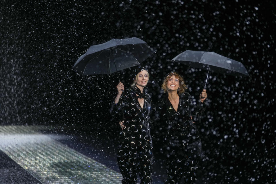 Models wear creations part of the Emporio Armani women's Fall-Winter 2024-25 collection presented in Milan, northern Italy, Thursday, Feb. 22, 2024. (AP Photo/Luca Bruno)