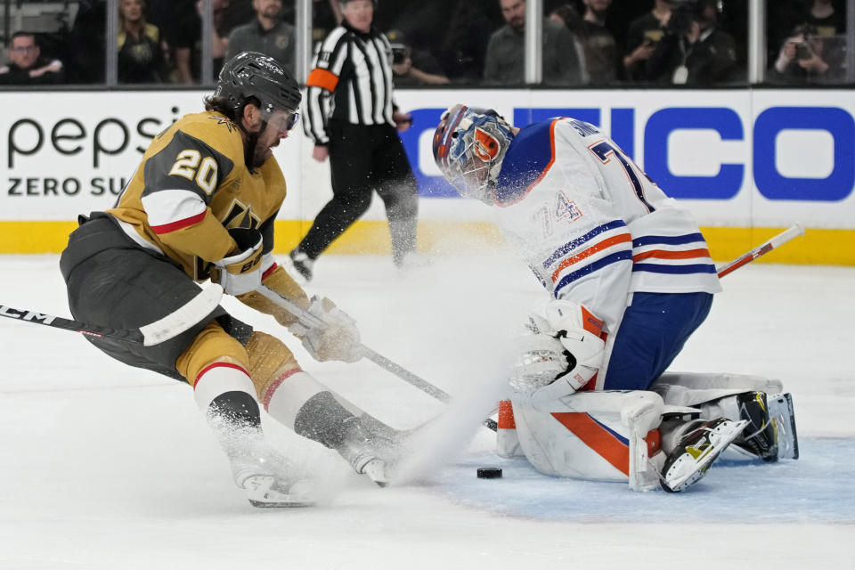 Edmonton Oilers goaltender Stuart Skinner (74) blocks a shot by Vegas Golden Knights center Chandler Stephenson (20) during the second period of Game 2 of an NHL hockey Stanley Cup second-round playoff series Saturday, May 6, 2023, in Las Vegas. (AP Photo/John Locher)