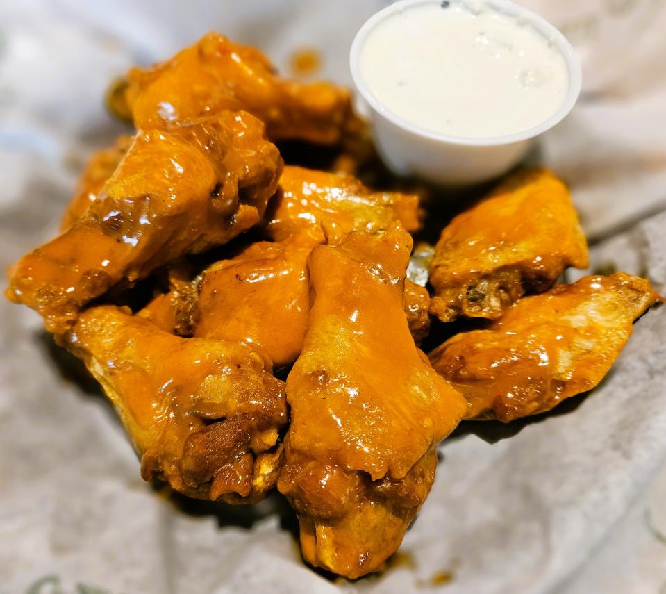 An order of 10 wings tossed in Beef’s Signature Buffalo Sauce at the Beef 'O' Brady's at 4925 Cortez Road W., Bradenton, photographed Sept. 25, 2003.
