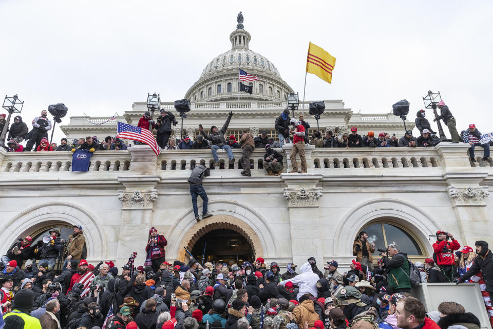 WASHINGTON DC, DISTRICT OF COLUMBIA, UNITED STATES - 2021/01/06: Protesters seen all over Capitol building where pro-Trump supporters riot and breached the Capitol. Rioters broke windows and breached the Capitol building in an attempt to overthrow the results of the 2020 election. Police used batons and tear gas grenades to eventually disperse the crowd. Rioters used metal bars and tear gas as well against the police. (Photo by Lev Radin/Pacific Press/LightRocket via Getty Images)