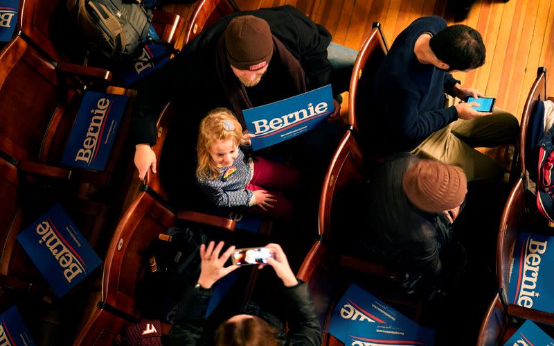 A girl holds a sign for Democratic U.S. presidential candidate Senator Bernie Sanders at a campaign event in the Rochester Opera House in Rochester