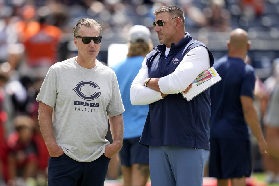 Chicago Bears head coach Matt Eberflus, left, speaks with Tennessee Titans head coach Mike Vrabel prior to an NFL preseason football game, Saturday, Aug. 12, 2023, in Chicago. (AP Photo/Charles Rex Arbogast)