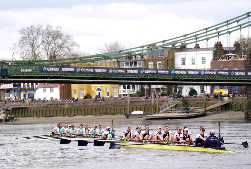 Cambridge (left) and Oxford pass under Hammersmith bridge during the 76th Women’s Boat Race on the River Thames, London. (PA)
