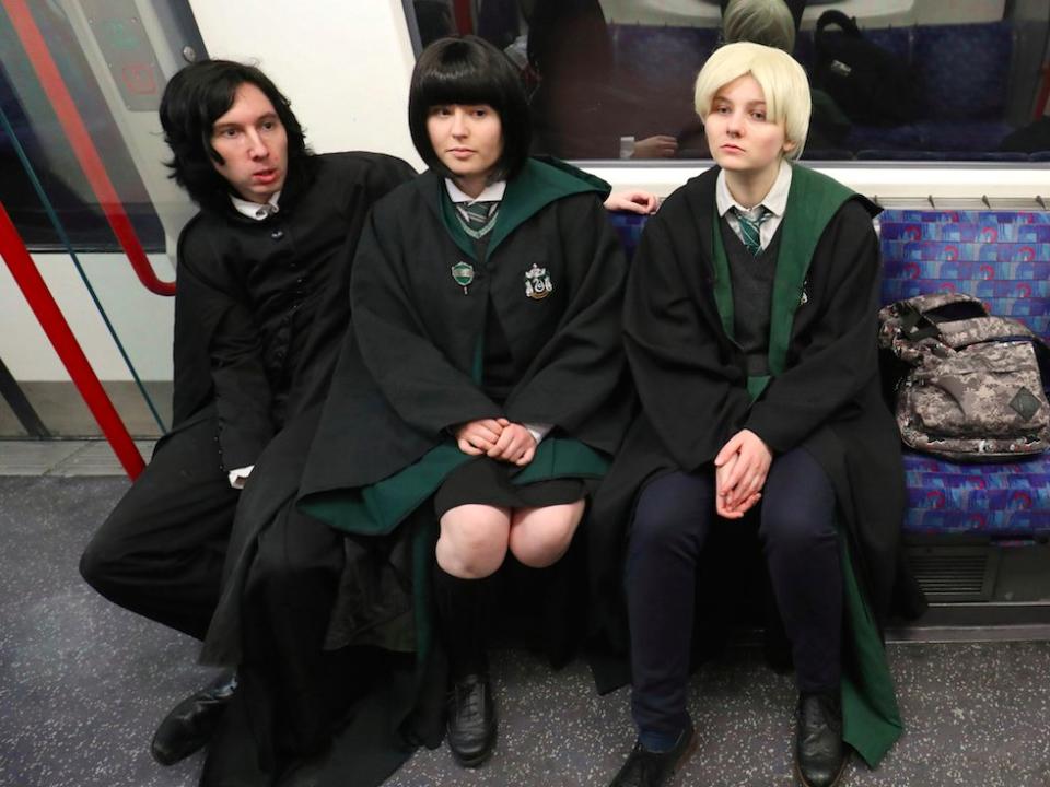 Cosplay fans (L-R) George Massingham, Abbey Forbes and Karolina Goralik travel by tube dressed in Harry Potter themed costumes, after a visit to one the literary franchise's movie filming locations at Leadenhall Market in London, Britain, March 10, 2017.