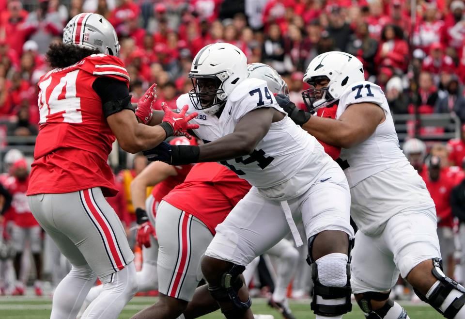 Oct 21, 2023; Columbus, Ohio, USA; Ohio State Buckeyes defensive end JT Tuimoloau (44) goes up against Penn State Nittany Lions offensive lineman Olumuyiwa Fashanu (74) during the third quarter of their game at Ohio Stadium.