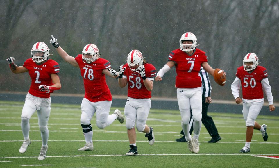 Reeds Spring football players celebrate the school's first state semifinal win after beating Sullivan 49-20 on Saturday, Nov. 26, 2022. The Wolves will play Cardinal Ritter on Dec. 3 in Columbia for the state championship.