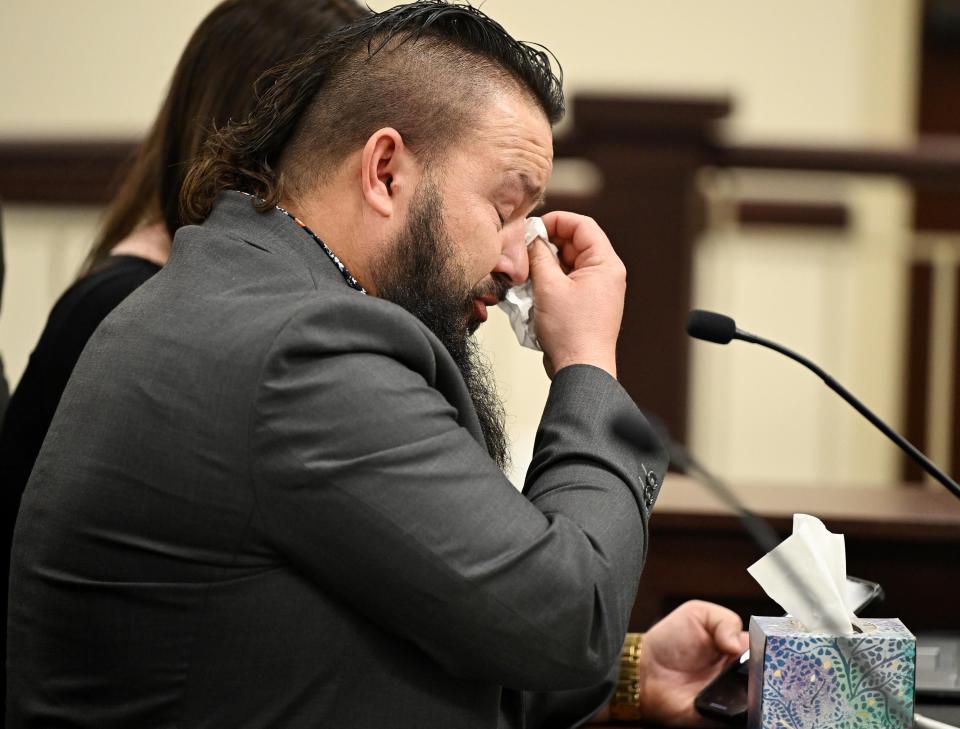 Karl Obray wipes tears as he and his wife, Brittney Obray, talk about their son Dexton, who committed suicide due to social media influences, during a House Judiciary Committee hearing as Rep. Jordan Teuscher, R-South Jordan, presents HB464, Social Media Regulation Act Amendments, at the Capitol in Salt Lake City on Wednesday, Feb. 14, 2024. | Scott G Winterton, Deseret News