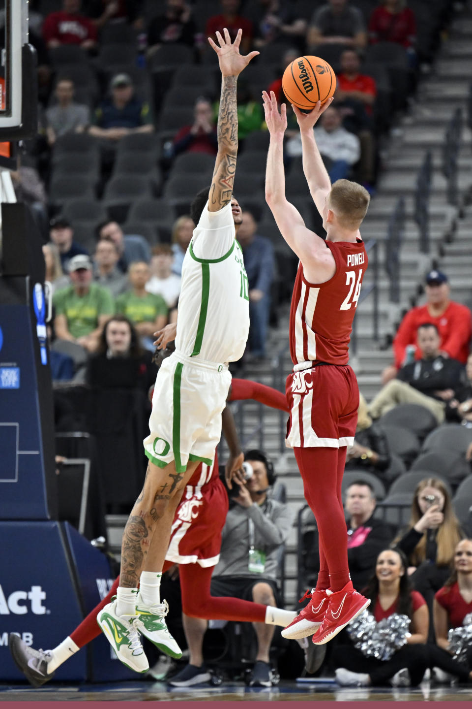Washington State guard Justin Powell (24) shoots against Oregon center Kel'el Ware (10) during the second half of an NCAA college basketball game in the quarterfinals of the Pac-12 men's tournament Thursday, March 9, 2023, in Las Vegas. (AP Photo/David Becker)