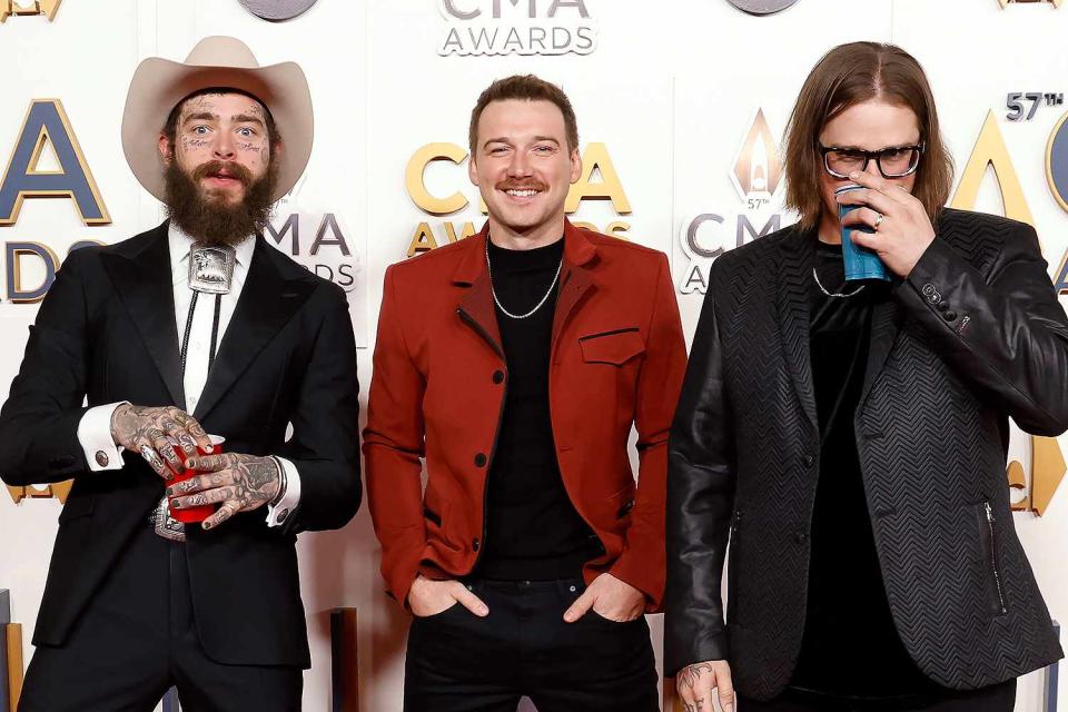 <p>Taylor Hill/WireImage</p> Post Malone, Morgan Wallen, and HARDY attend the 2023 CMA Awards 