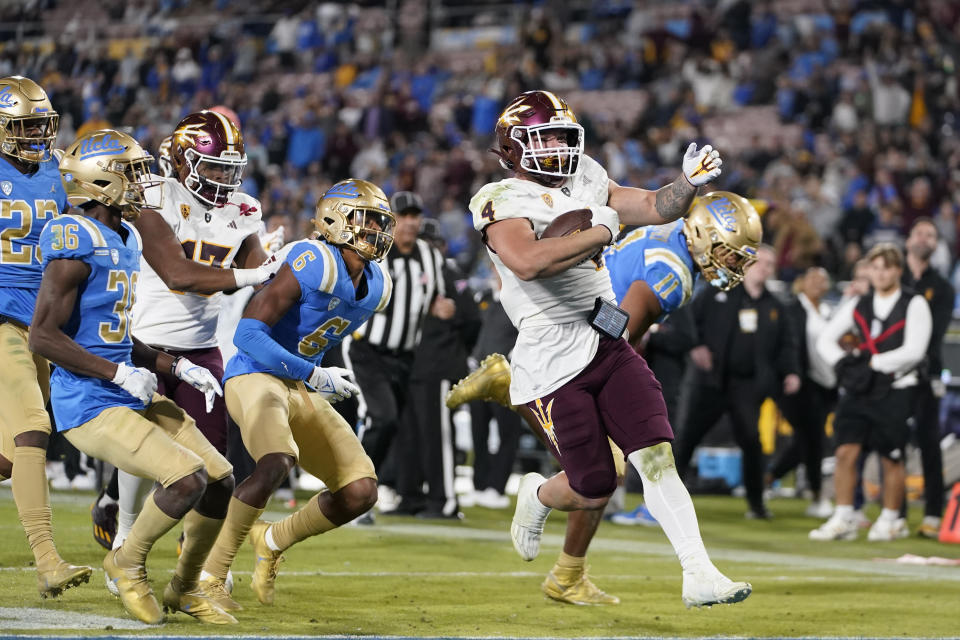 Arizona State running back Cameron Skattebo (4) scores a touchdown against UCLA during the second half of an NCAA college football game Saturday, Nov. 11, 2023, in Pasadena, Calif. (AP Photo/Ryan Sun)