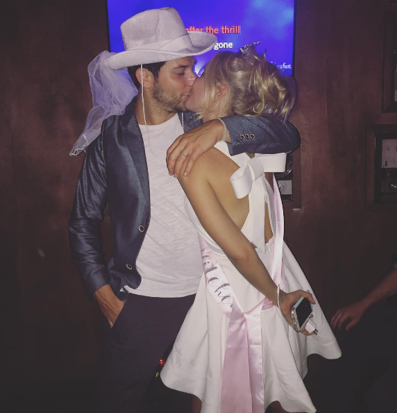 Skylar Astin and Anna Camp kiss at their joint stag party. (Photo: Instagram)