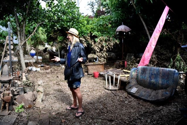 Christine Devine walks through her flood ravaged home and business the Devine Healing Sanctuary in Lismore, NSW. Source: AAP