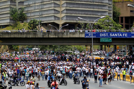 Opposition demonstrators rally against Venezuela's President Nicolas Maduro in Caracas, Venezuela, April 20, 2017. REUTERS/Christian Veron