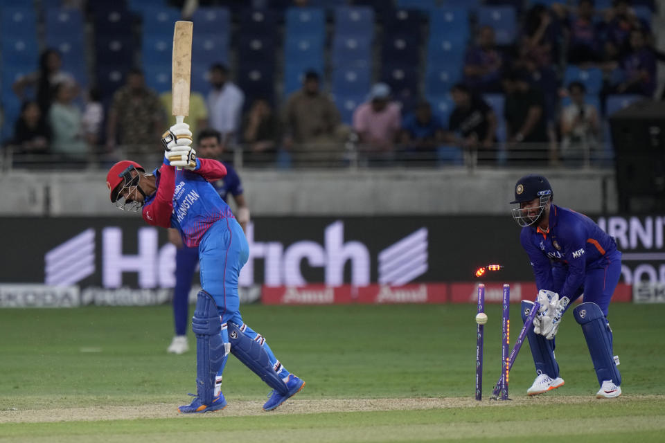 Afghanistan's Mujeeb Ur Rahman is bowled out by India's Ravichandran Ashwin during the T20 cricket match of Asia Cup between India and Afghanistan, in Dubai, United Arab Emirates, Thursday, Sept. 8, 2022. (AP Photo/Anjum Naveed)