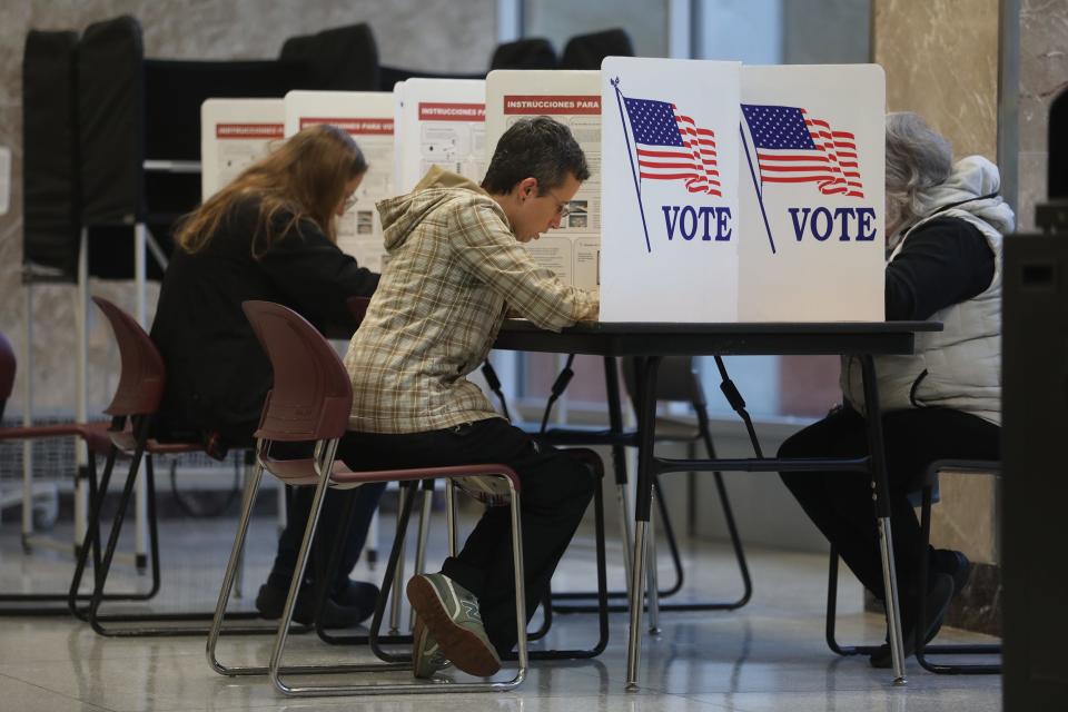 Rachel Hollar fills out her ballot at East High School in Rochester on Nov. 7, 2023. (Credit: Tina MacIntyre-Yee /Rochester Democrat and Chronicle)