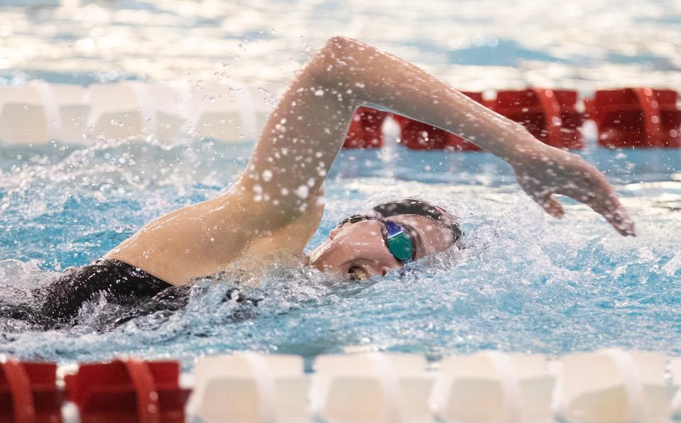 Jackson's Nina Shulik competes in the 500 yard freestyle against McKinley, and Marlington