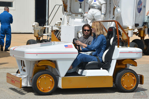 Actors Sebastian Stan and Mackenzie Davis from the movie "The Martian" take a spin in NASA's Modular Robotic Vehicle, or MRV, at the Johnson Space Center in Houston, Texas.