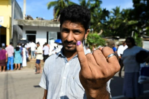 A man shows his inked finger after voting in the Sri Lankan presidential election