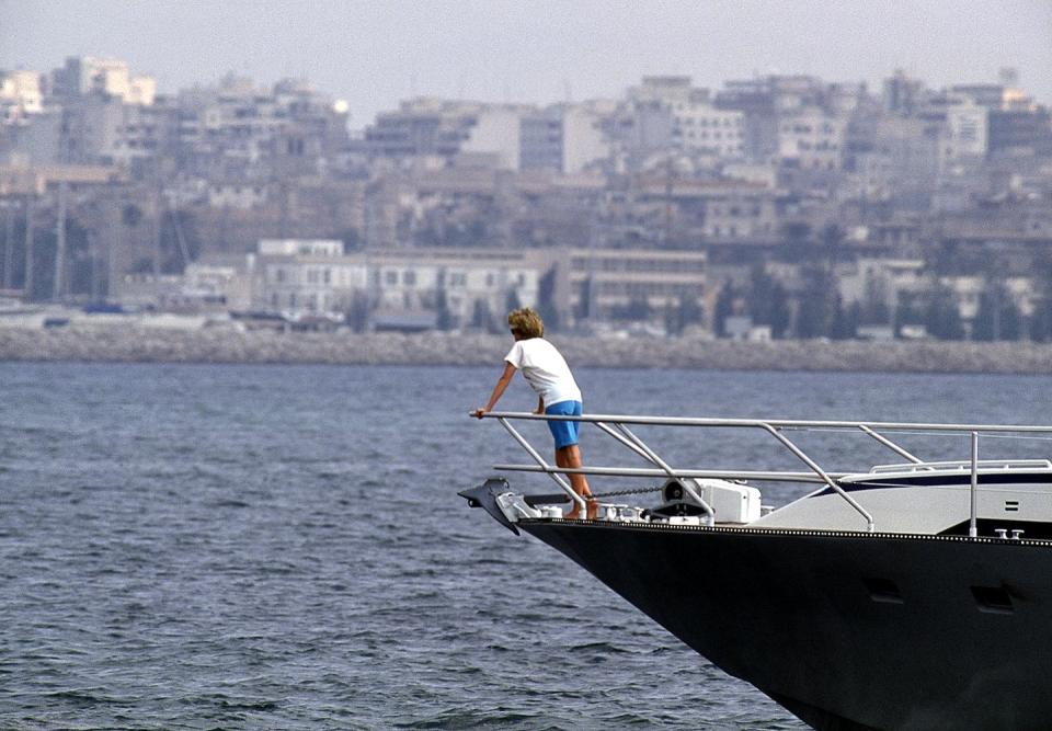 <p>Princess Diana and her family vacation in Spain with the Spanish royals in August 1990. The Princess of Wales found some alone time while sailing over the Palma de Mallorca harbor on Juan Carlos' boat. </p>