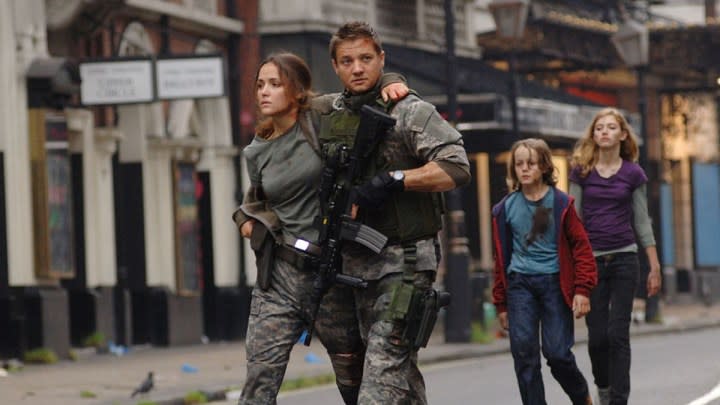 Four people walk in a street in 28 Weeks Later.