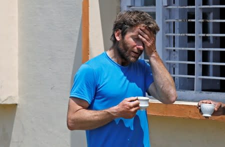 British Climber and expedition’s deputy leader, Mark Thomas reacts as he talks to an Indian Air Force pilot in Pithoragarh