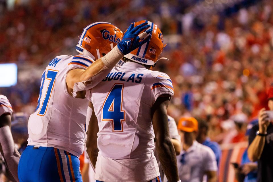 Florida Gators tight end Jonathan Odom (87) congratulates Florida Gators wide receiver Caleb Douglas (4) after scoring a touchdown during the season opener at Rice-Eccles Stadium in Salt Lake City on Thursday, Aug. 31, 2023. | Megan Nielsen, Deseret News