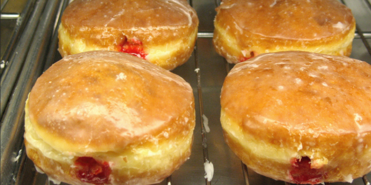 A rack of fresh-baked jelly donuts from Tonalli's Donuts in Portland, Oregon (FLICKR/ Mike mike Krzeszak)