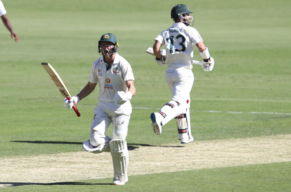 Australia's Marnus Labuschagne celebrates on reaching his century during play on the first day of the fourth cricket test between India and Australia at the Gabba, Brisbane, Australia, Friday, Jan. 15, 2021. (AP Photo/Tertius Pickard)