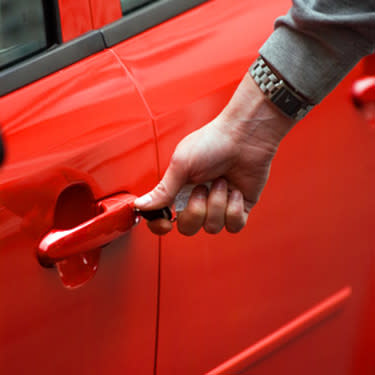 Hand-on-new-red-car_web