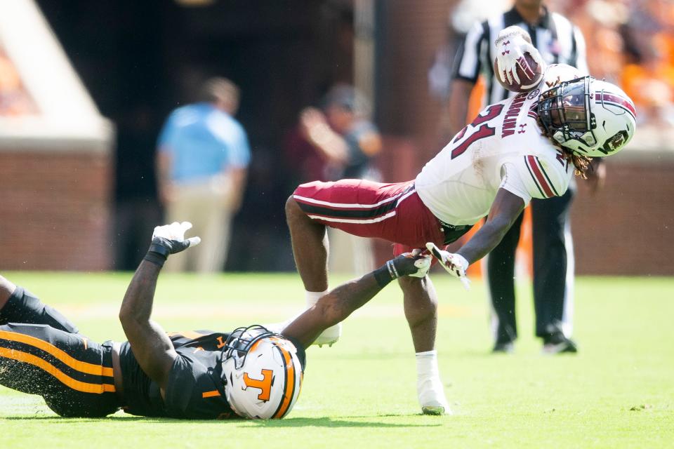 Tennessee defensive back Trevon Flowers (1) tries to take down South Carolina running back Juju McDowell (21) during a NCAA football game between the Tennessee Volunteers and the South Carolina Gamecocks at Neyland Stadium in Knoxville, Tenn. on Saturday, Oct. 9, 2021.