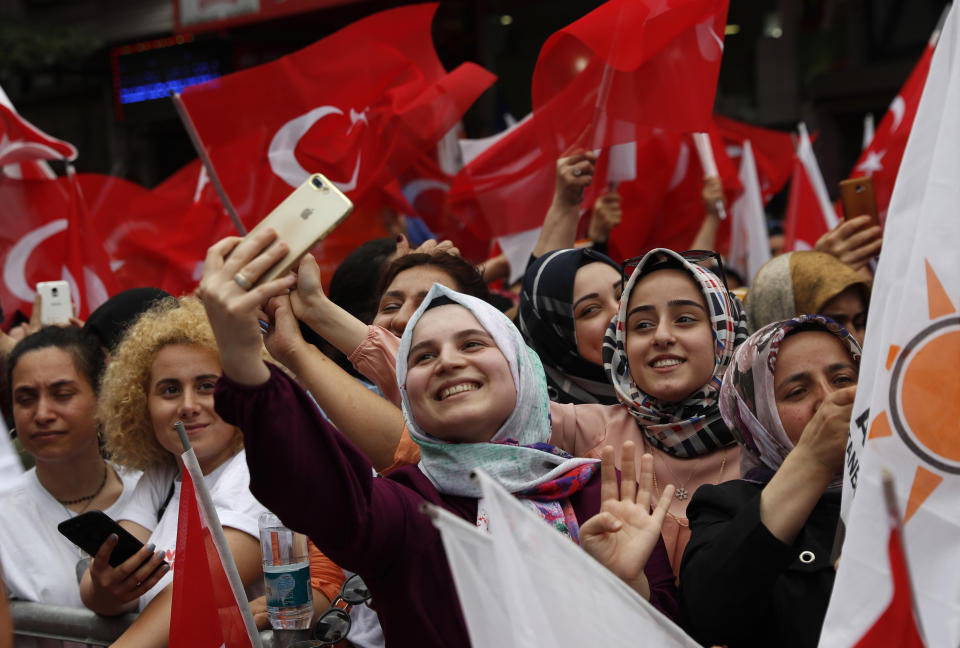 FILE-In this Friday, June 21, 2019 file photo, supporters of Binali Yildirim, mayoral candidate for Istanbul from Turkey's ruling Justice and Development Party, AKP, attend a rally in Istanbul, ahead of June 23 re-run of mayoral elections. Voters in Istanbul return to the polls Sunday for a rerun of an election for mayor of the city. (AP Photo/Lefteris Pitarakis, File)
