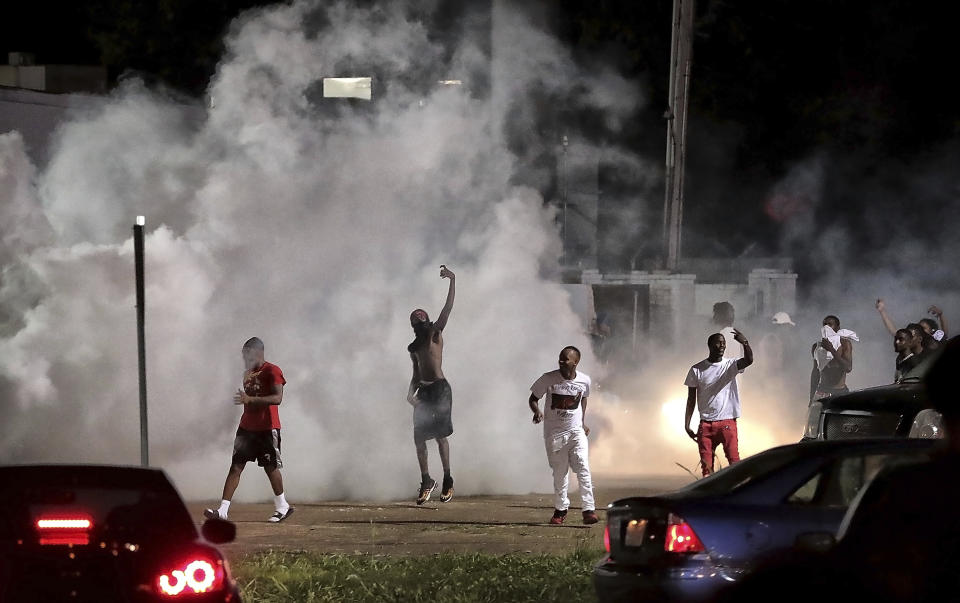 Frayser community residents taunt authorities as protesters take to the streets in anger against the shooting of a youth identified by family members as Brandon Webber by U.S. Marshals earlier in the evening, Wednesday, June 12, 2019, in Memphis, Tenn. Dozens of angry protesters clashed with police throwing stones and tree limbs until police forces broke the mob up with tear gas. (Photo: Jim Weber/Daily Memphian via AP)
