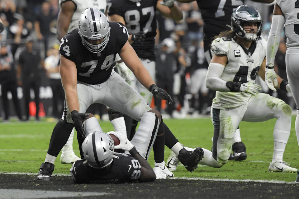 Las Vegas Raiders offensive tackle Kolton Miller (74) celebrates after wide receiver Bryan Edwards (89) scored a touchdown against the Philadelphia Eagles during the second half of an NFL football game, Sunday, Oct. 24, 2021, in Las Vegas. (AP Photo/David Becker)