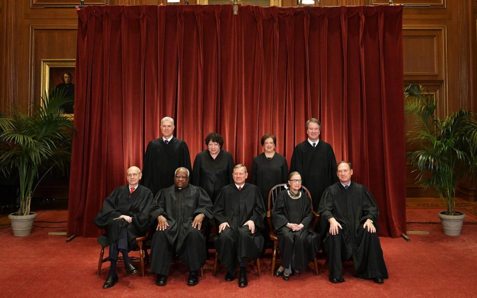 Ginsburg with the eight other Supreme Court justices in 2018 - GETTY IMAGES