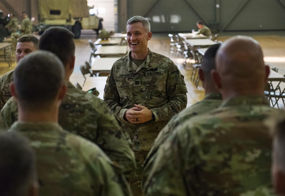 Capt. Ernie Griffin of the 1st Battalion, 163rd Field Artillery of the Indiana Army National Guard addresses his soldiers ahead of weapons qualifications training Friday morning, June 24, 2022.