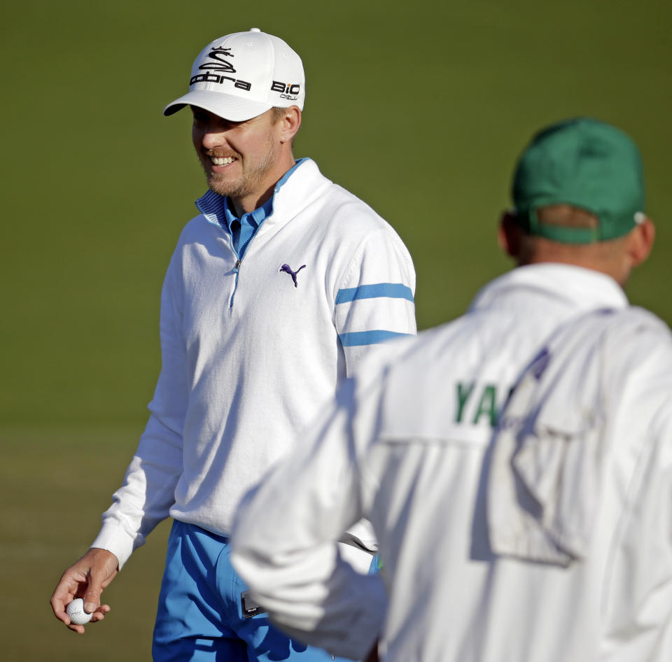 Jonas Blixt, of Sweden, walks off the seonc green after a birdie putt during the first round of the Masters golf tournament Thursday, April 10, 2014, in Augusta, Ga. (AP Photo/Chris Carlson)